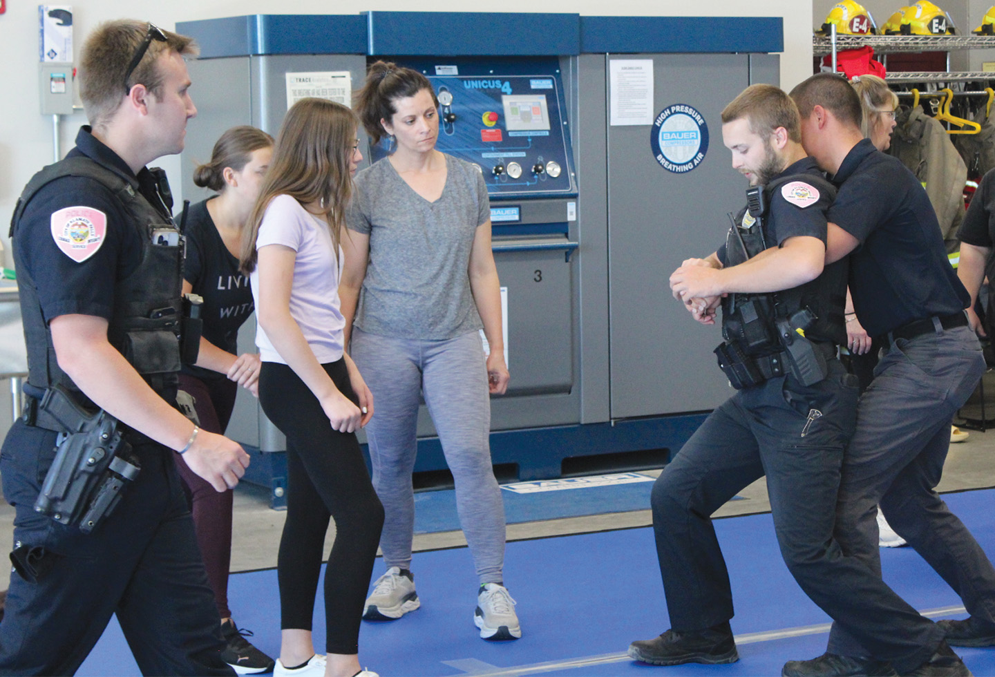 Members of the Klamath Falls Police Department demonstrate how to to break free from an attacker at the Oct. 5 self-defense workshop held on the KCC campus. (KCC photo)