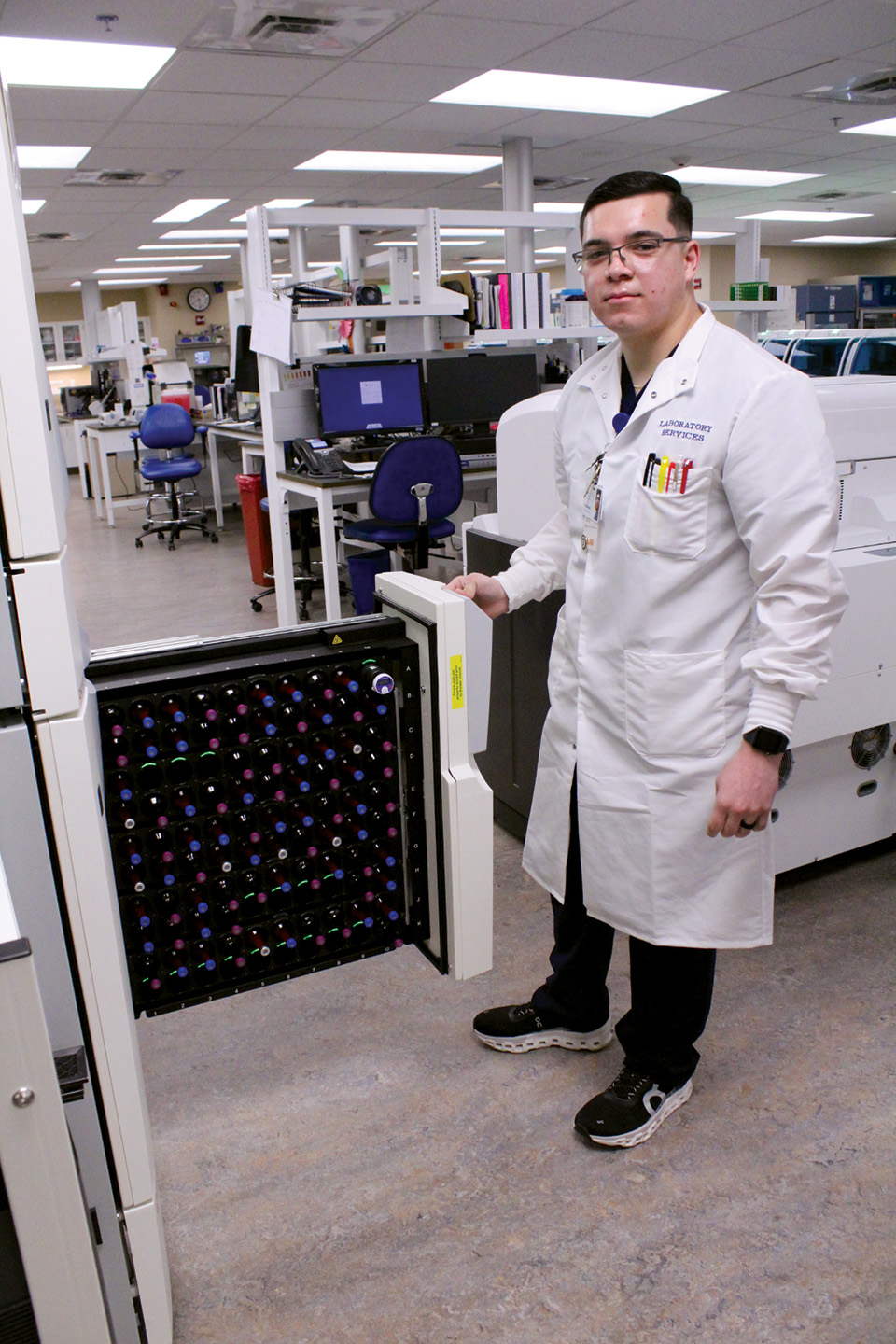 Fernando Torres, a lab technician at Sky Lakes Medical Center, demonstrates some of the research techniques used to identify blood types