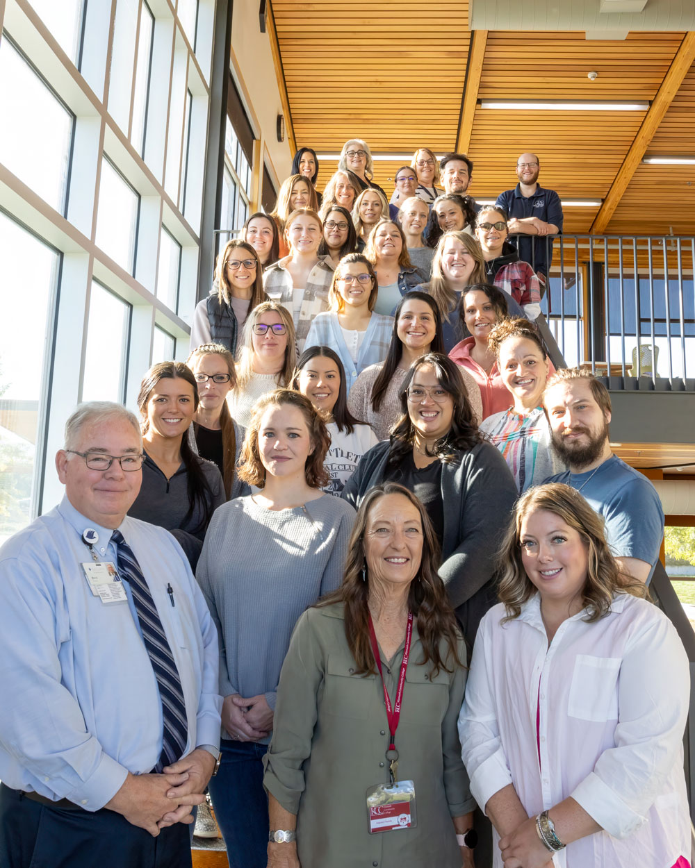 Reid Kennedy, front left, of Sky Lakes Medical Center joins students and staff in the Klamath Community College Nursing program at the start of fall term to continue an annual donation of laptops to new nursing students.